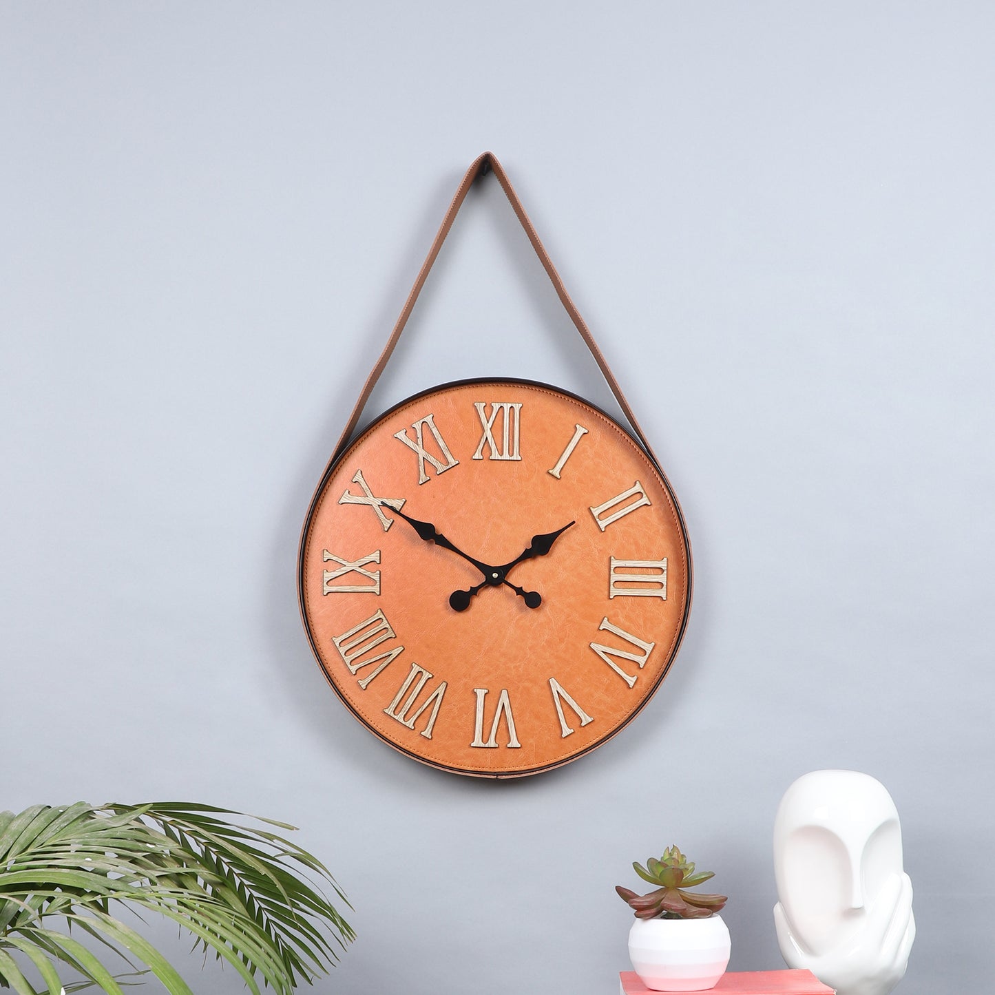 brown leather belt wall clock