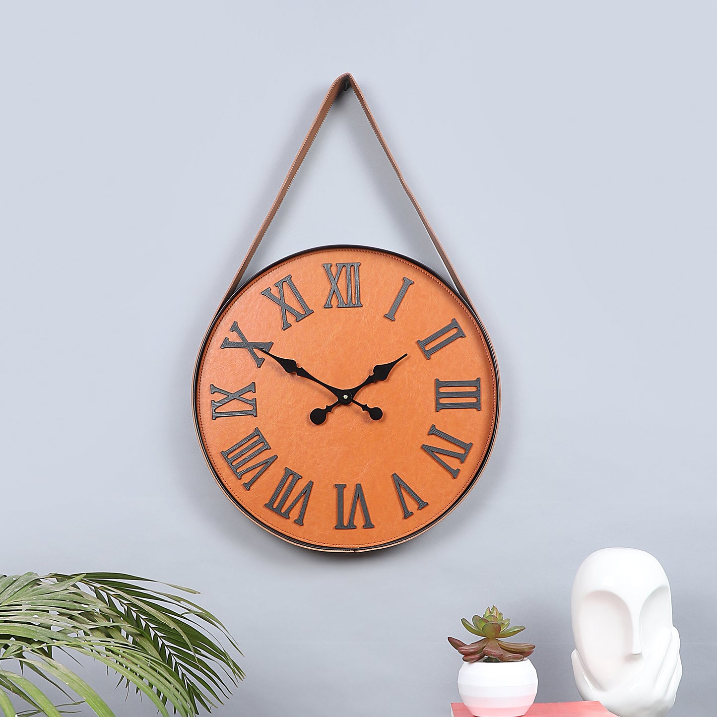 brown leather belt wall clock