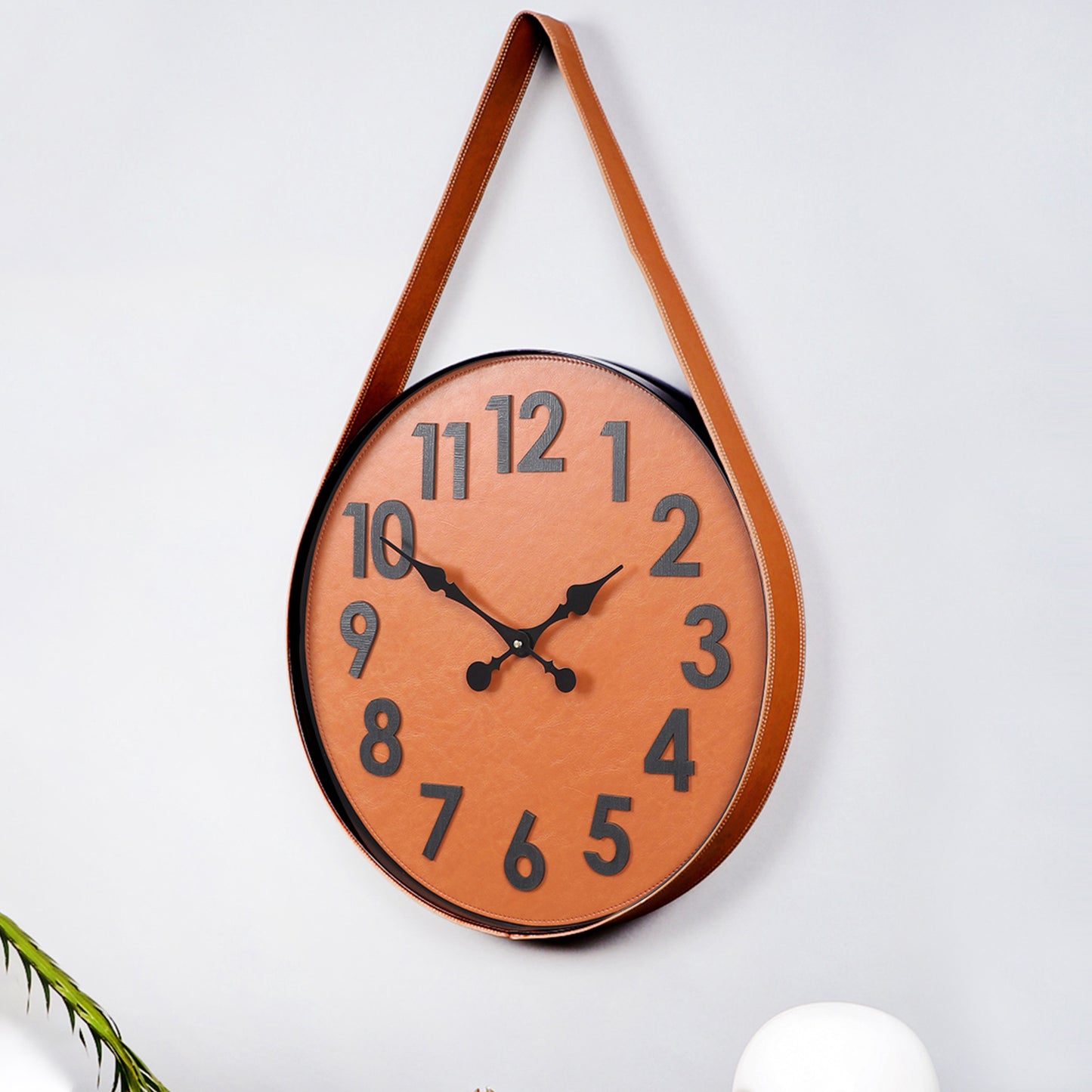 brown numerical belt wall clock